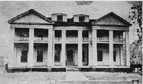 Photograph of Kirby's two-story, columned, white antebellum home on Alta Vista plantation.